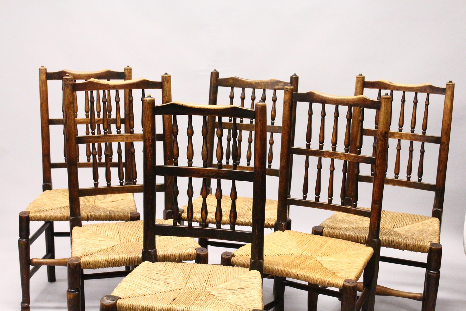 A MATCHED SET OF SIX 19TH CENTURY ASH SPINDLE BACK DINING CHAIRS, with rush seats on turned and - Image 8 of 9