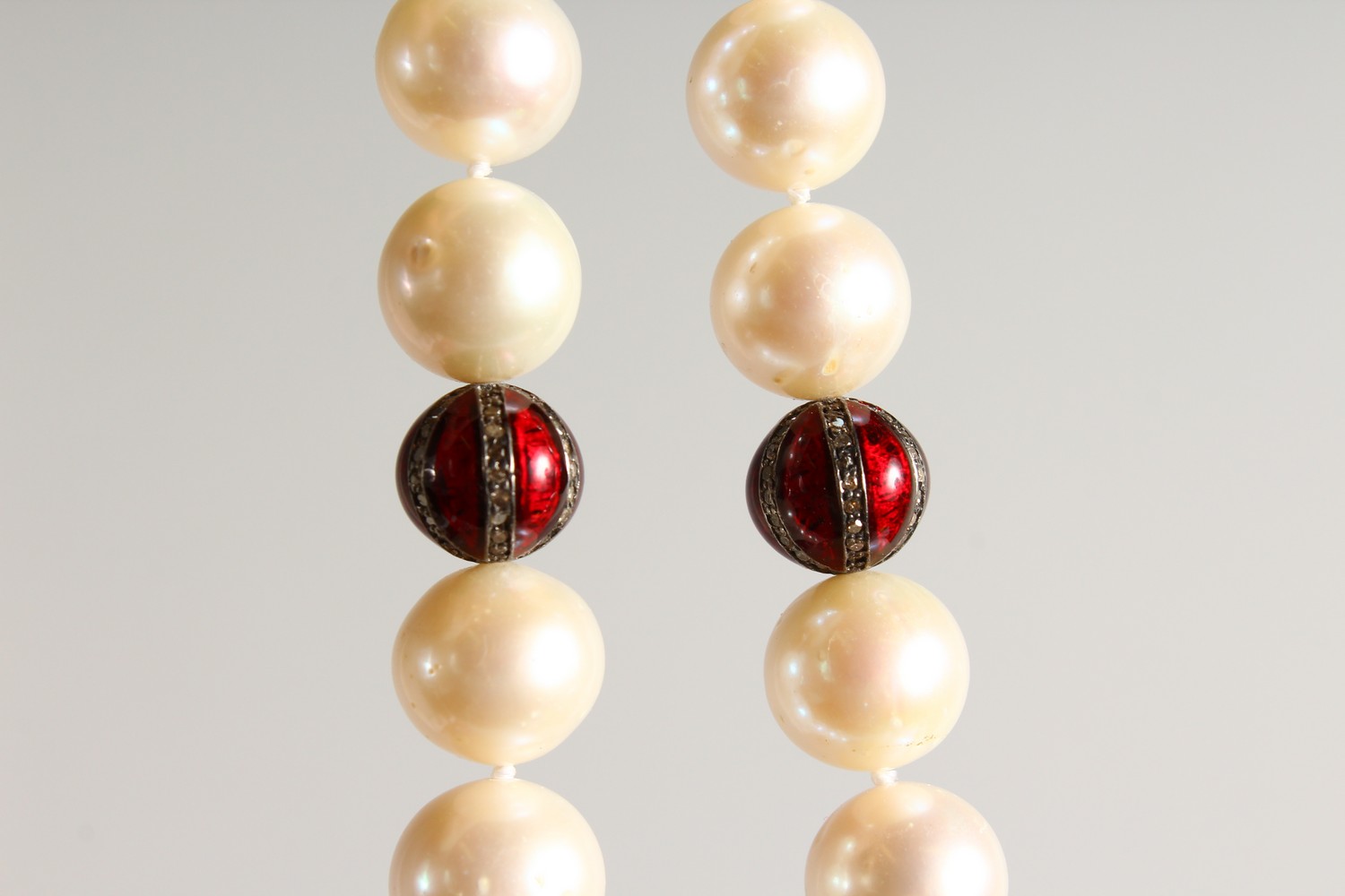 A PEARL NECKLACE, with three diamond and enamel sections and 18ct gold clasp. 18ins long. - Image 2 of 5