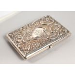 A SILVER CARD CASE WITH EMBOSSED DECORATION. 4.25ins x 3ins.