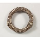 AN EASTERN WHITE METAL BANGLE. 3.5ins diameter.