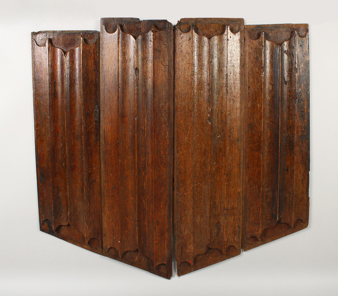 FOUR PIECES OF 17TH/18TH CENTURY OAK LINEN FOLD STYLE CARVED PANELS. Largest: 28ins x 7.5ins.