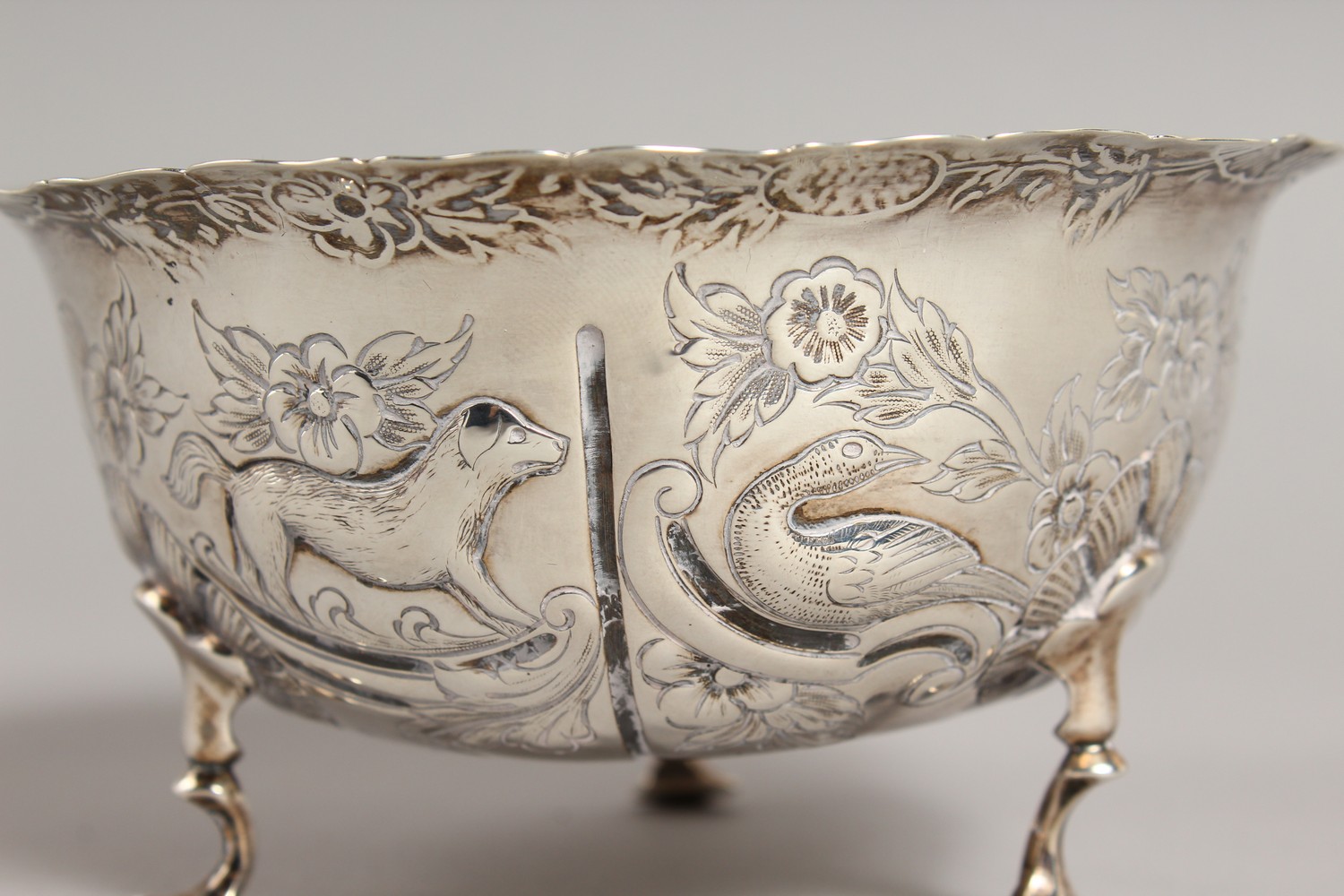 A VICTORIAN CIRCULAR SUGAR BOWL, repousse with birds, animals etc., on three pad feet. 4.75ins - Image 5 of 10