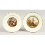 A PAIR OF PLATES, "The Rivals" and "Faggot Gatherers". 8.25ins diameter.