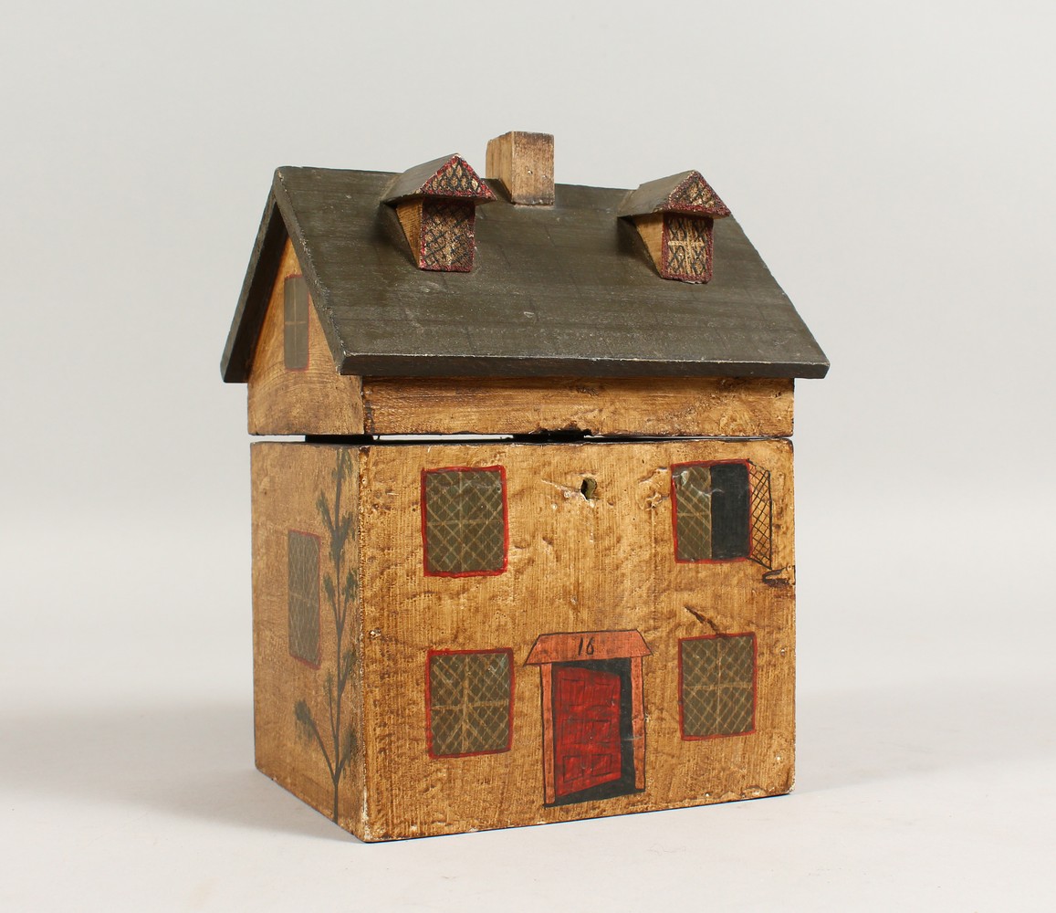 A PAINTED HOUSE STYLE TEA CADDY. 6.25ins wide.