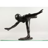 AFTER EDGAR DEGAS A BRONZE BALLERINA, balancing on one leg, arms outstretched. 20ins wide.