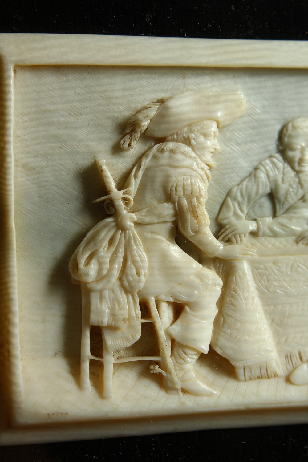 A GOOD SMALL CARVED IVORY PLAQUE, LATE 19TH/EARLY 20TH CENTURY, depicting cavaliers seated around - Image 4 of 7