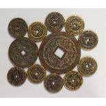 TWELVE CHINESE BRONZE COINS. Various Sizes.
