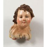 AN 18TH CENTURY PAINTED NEAPOLITAN BUST OF A CHERUB. 3ins.