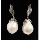 A PAIR OF SILVER BAROQUE PEARL EARRINGS.