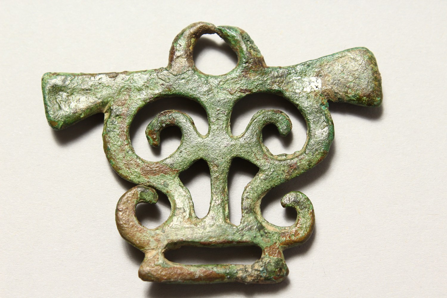 A ROMAN PIERCED BRONZE AMULET/BUCKLE. 3ins wide. - Image 3 of 4