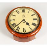 A GEORGE V MAHOGANY CIRCULAR WALL CLOCK, with fusee movement. 12ins diameter.