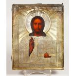 A RUSSIAN SILVER AND SILVER GILT ICON. Christ. Silver Marks A.P. over 1894 84 and other marks.