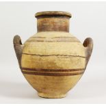 AN EARLY GREEK/CYPRIOT TWIN-HANDLED EARTHENWARE VESSEL, with painted decoration. 11.5ins high.