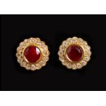 A PAIR OF 18CT YELLOW GOLD, RUBY AND DIAMOND CLUSTER EARRINGS.