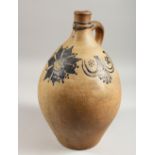 A LARGE BELLARMINE STYLE STONEWARE JUG. 14.5ins high.