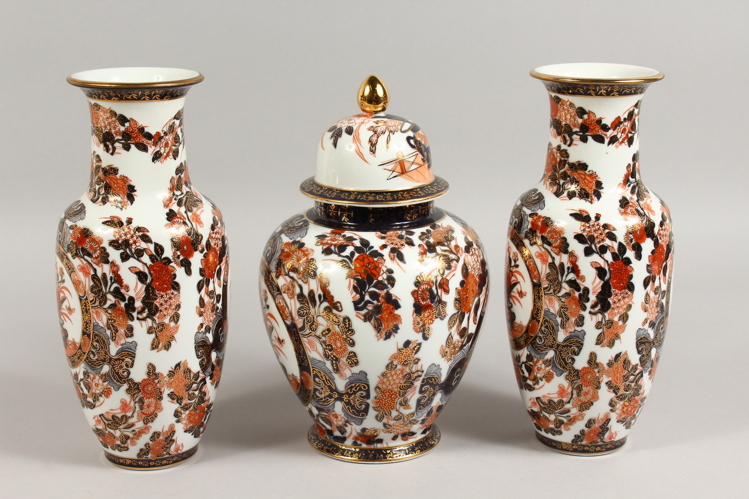 A JAPANESE IMARI GARNITURE, comprising a pair of vases and ginger jar and cover. Vases: 10.5ins - Image 2 of 7