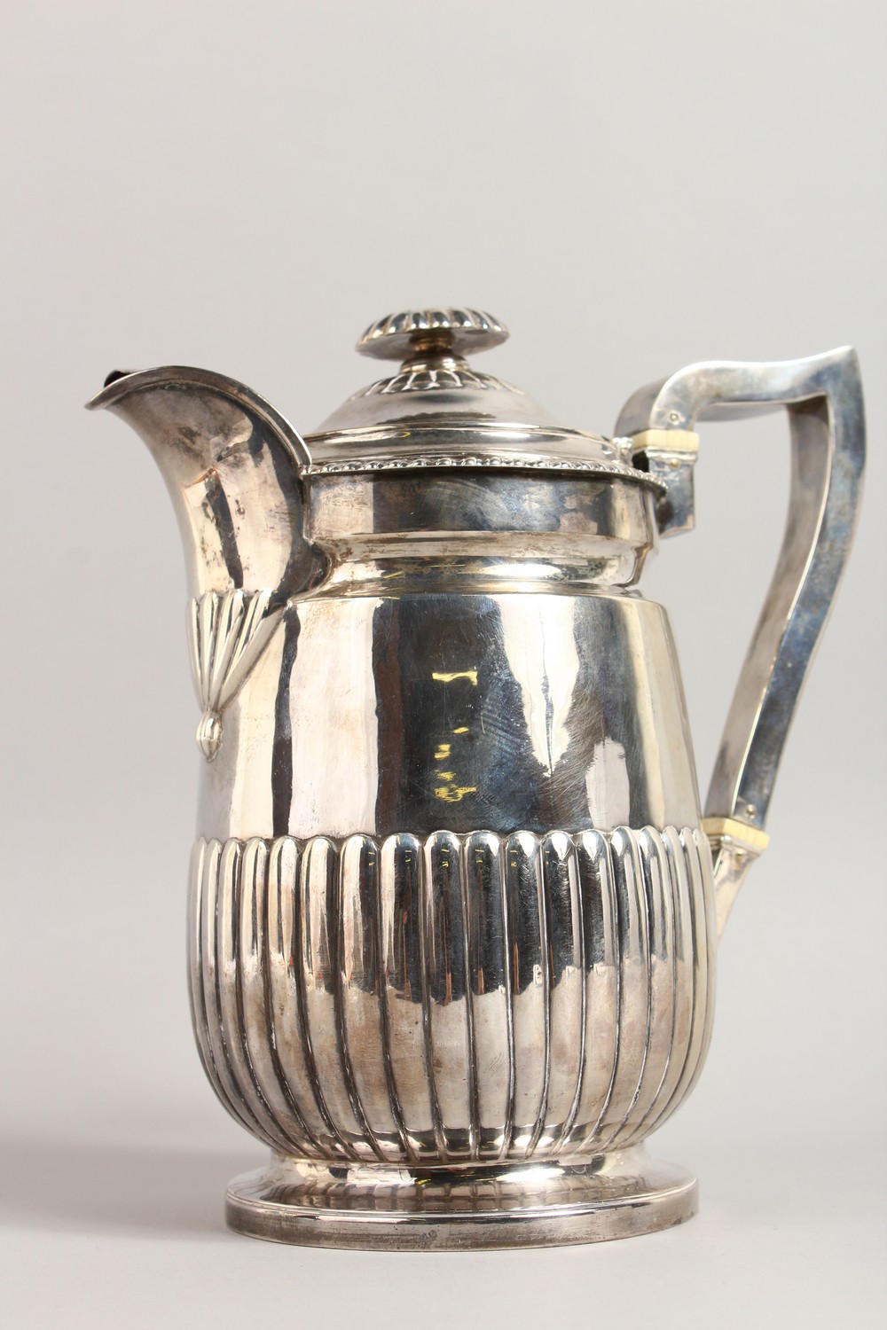 A GEORGE III SEMI FLUTED JUG, with gadrooned edge, crested. London 1815. Maker: R.E. Weight 22ozs. - Image 3 of 11