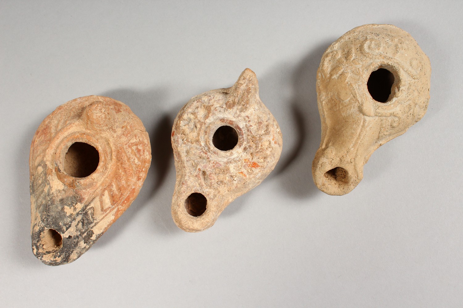 THREE ROMAN TERRACOTTA OIL LAMPS. - Image 2 of 6