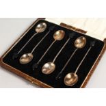 A SET OF SIX "COFFEE BEAN" SPOONS, cased. Birmingham 1925.