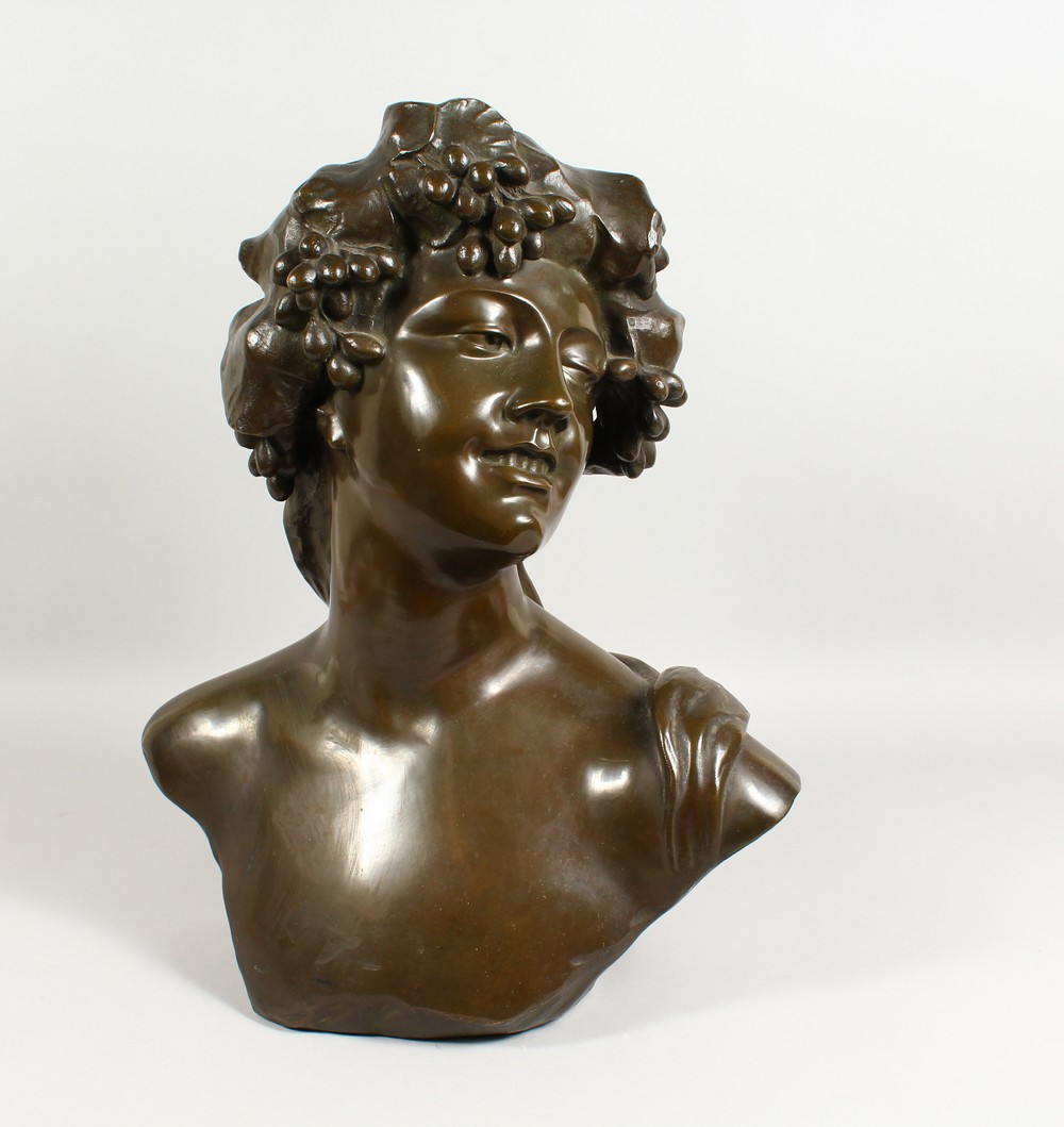 AFTER LAMBEAUX A LARGE CAST BRONZE BUST OF A YOUNG LADY. 21ins high.