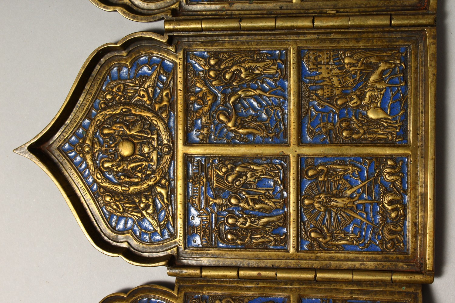 A FOUR PIECE RUSSIAN BRASS AND BLUE ENAMEL FOLDING ICON, with sixteen small panels, 1.75ins square - Image 3 of 11