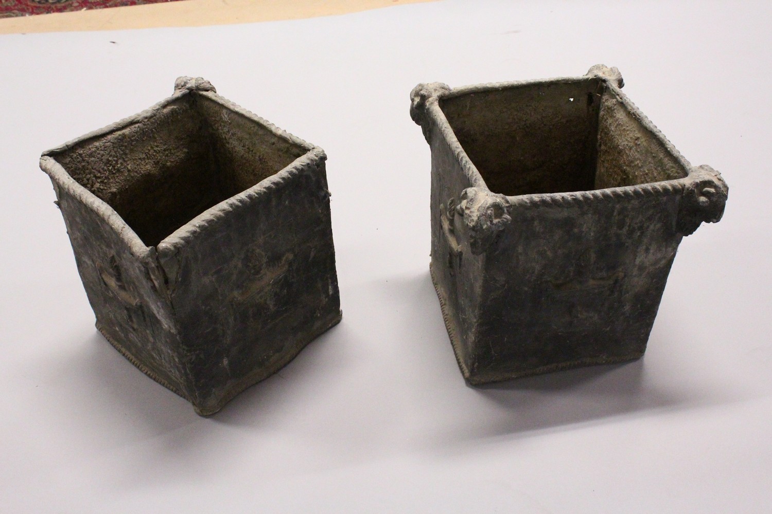 A PAIR OF 19TH/20TH CENTURY LEAD PLANTERS, of square shape, with rams head corners and classical - Image 6 of 6
