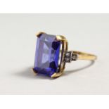 A FAUX TANZANITE RING.