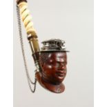 A VERY GOOD CARVED WOOD, HORN AND IVORY PIPE, with silver mount, the bowl carved as a male bust.