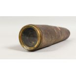 AN OLD LEATHER COVERED BRASS TELESCOPE. 10.5ins long.