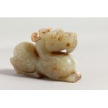 A CARVED JADE DRAGON. 3ins long.