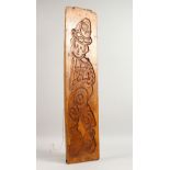 A 19TH CENTURY SINGLE SIDED PINE GINGERBREAD MOULD, carved with a figure of a man. 33ins x 8ins.