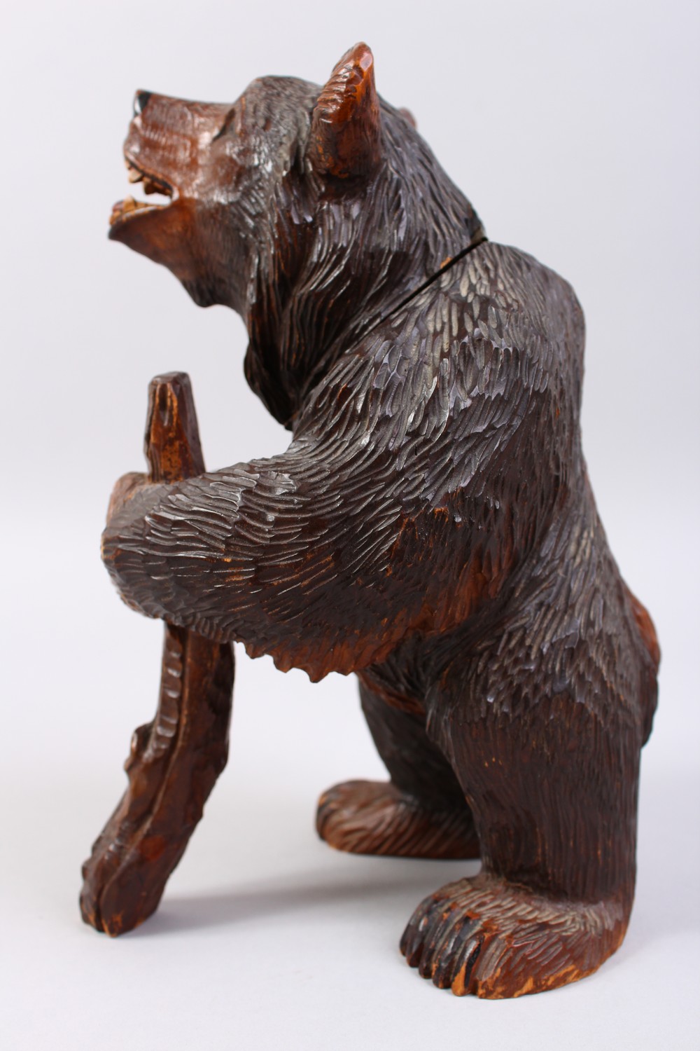 A GOOD 19TH CENTURY BLACK FOREST CARVED WOOD STANDING BEAR CADDY, with hinged head. 11ins high. - Image 5 of 12