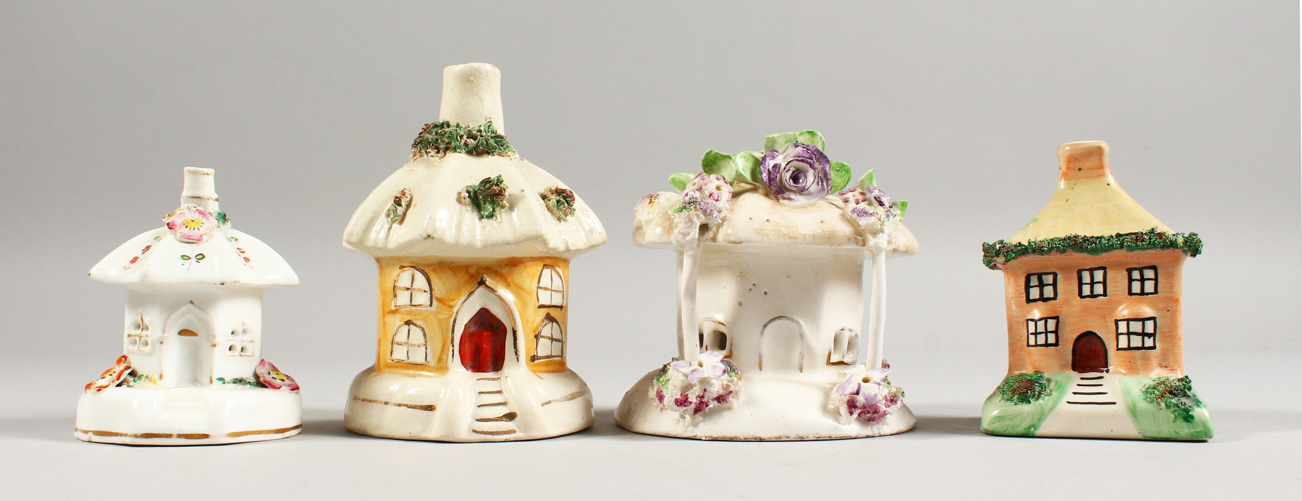 FOUR SMALL 19TH CENTURY STAFFORDSHIRE PASTILLE BURNER COTTAGES.