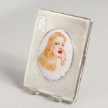 A GOOD ENGINE TURNED SILVER CIGARETTE CASE, the lid with an enamel, smoking a cigarette.