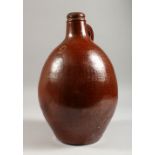 A LARGE BELLARMINE STYLE STONEWARE JUG. 13.5ins high.