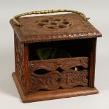 A 19TH CENTURY OAK BOX, with brass handle, carved with birds and flowers, with removable front,