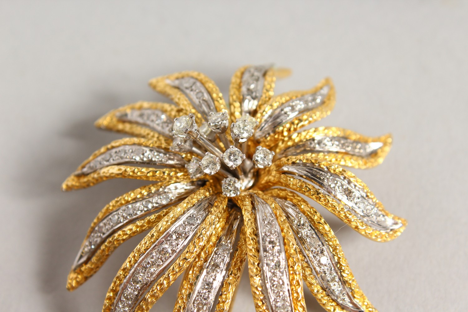 A GOOD 18CT GOLD AND DIAMOND SET FLOWER HEAD BROOCH. 2.25ins long. - Image 3 of 12