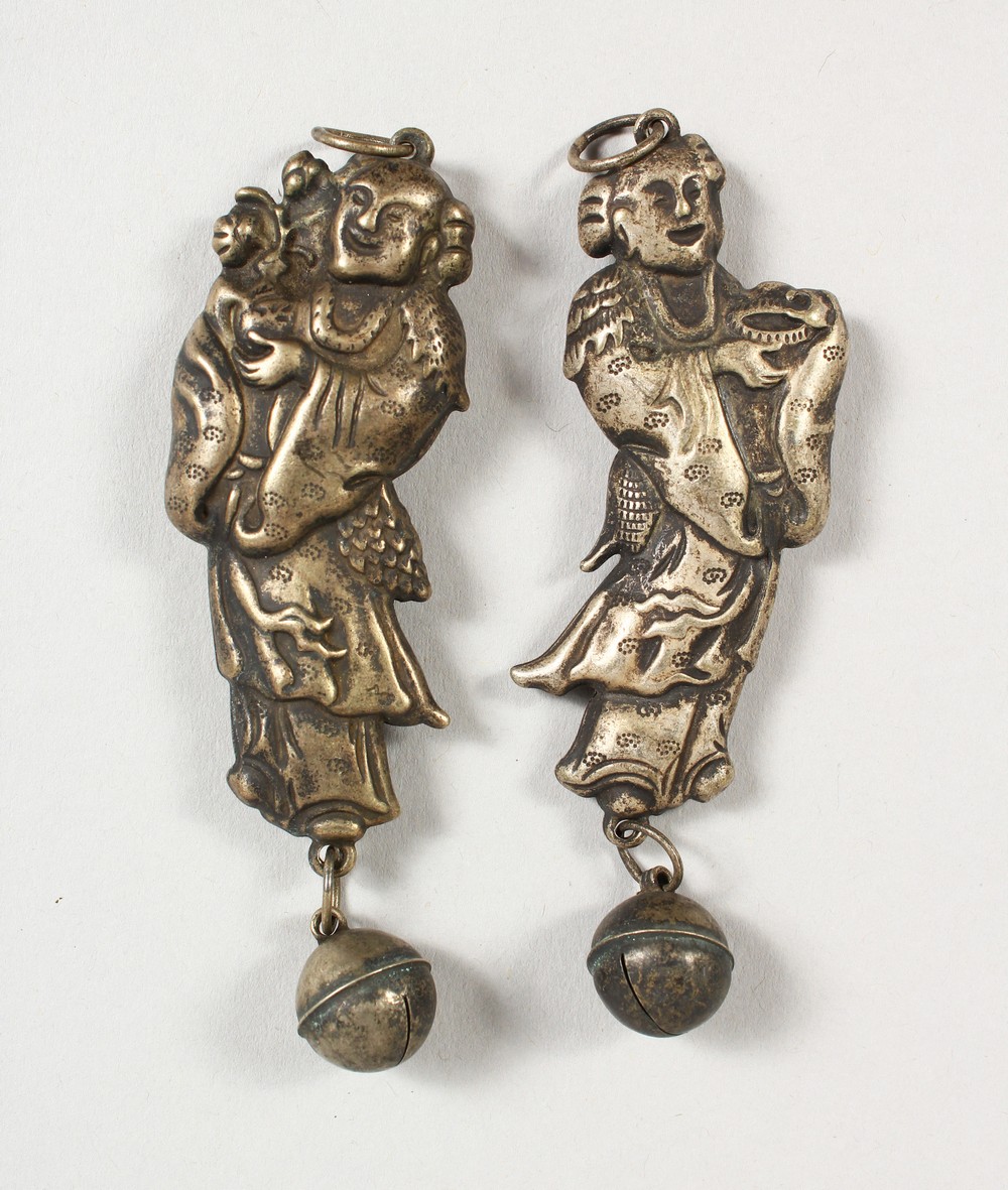 A PAIR OF CHINESE SILVER FIGURAL RATTLES. 3ins high.