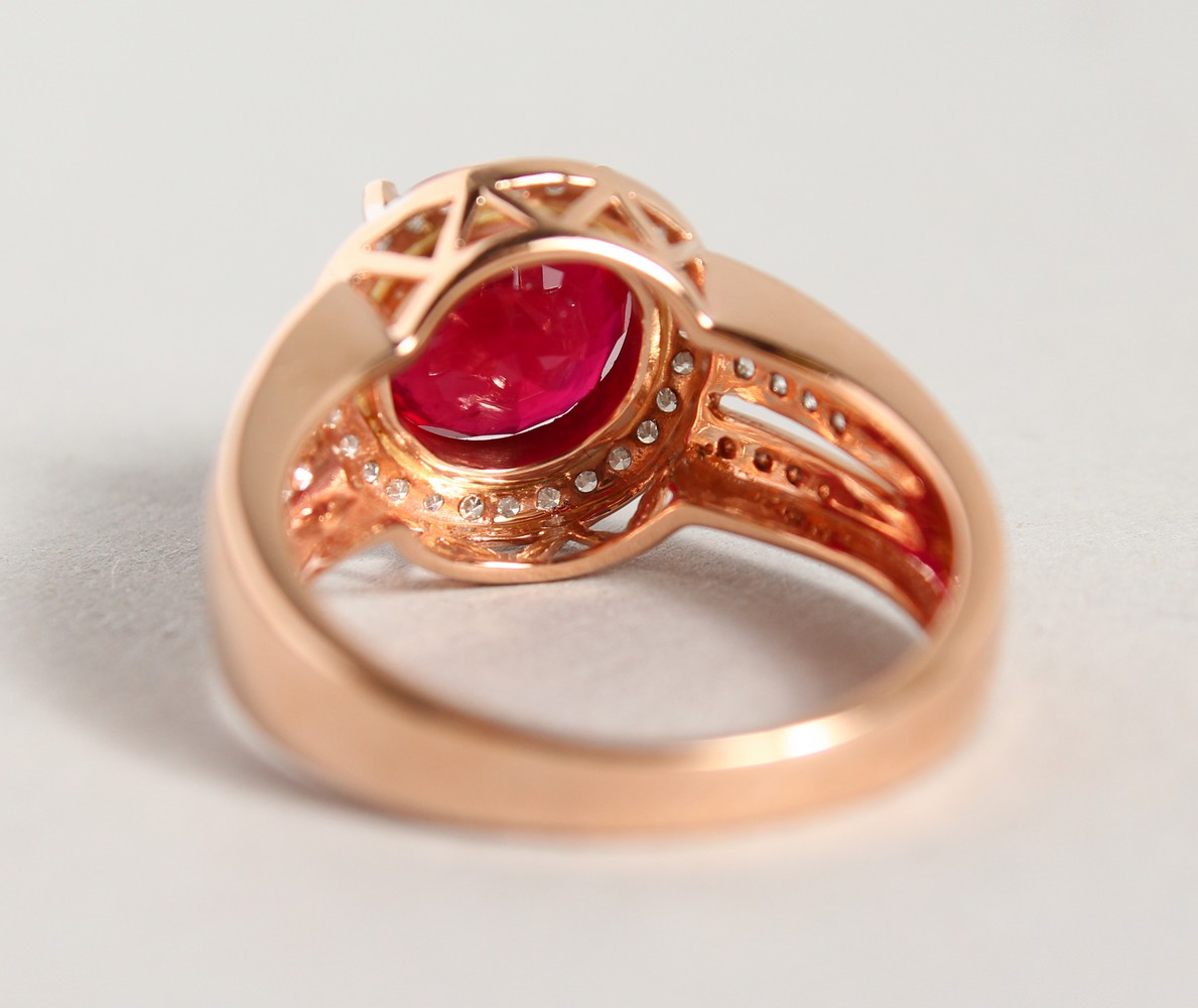 A 14K ROSE GOLD AND DIAMOND RING, set with an oval cut ruby approx. 4ct, diamonds approx. 0.48ct - Image 5 of 6