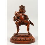 AN EASTERN EROTIC CARVED WOOD FIGURE GROUP. 6ins high.