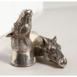 A GOOD PAIR OF NOVELTY SILVER HORSES HEAD SALT AND PEPPERS. 2.75ins high.