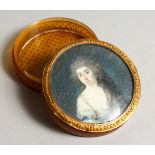 A GEORGE III CIRCULAR TORTOISESHELL BOX, the lid with a portrait of a lady. 3ins diameter.