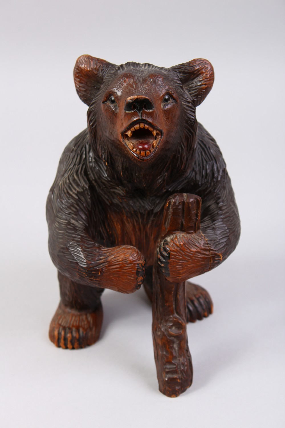 A GOOD 19TH CENTURY BLACK FOREST CARVED WOOD STANDING BEAR CADDY, with hinged head. 11ins high. - Image 2 of 12