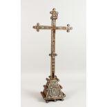 AN 18TH/19TH CENTURY GOAN MOTHER-OF-PEARL INLAID CRUCIFIX, supported on a triangular base. 26ins