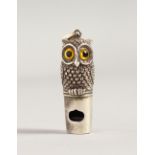 A CAST SILVER NOVELTY OWL WHISTLE. 1.5ins long.
