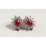 A PAIR OF 9CT GOLD, RUBY AND DIAMOND CLUSTER EARRINGS.