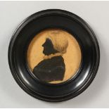 A CIRCULAR SILHOUETTE OF A LADY, in an ebony frame. 4ins diameter.