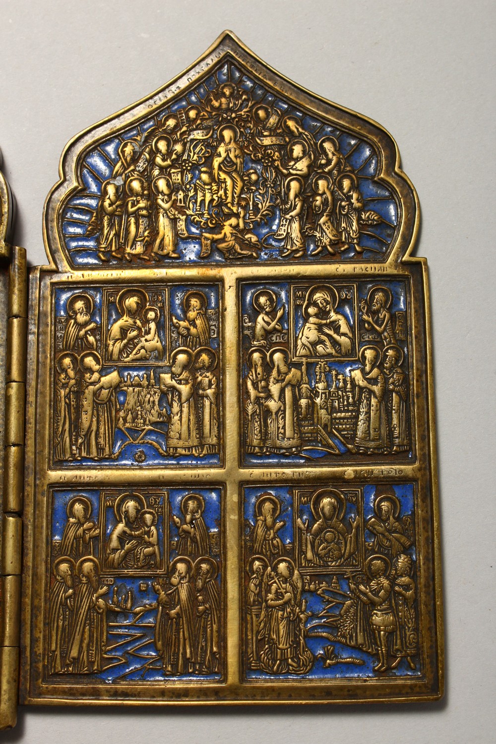 A FOUR PIECE RUSSIAN BRASS AND BLUE ENAMEL FOLDING ICON, with sixteen small panels, 1.75ins square - Image 5 of 11
