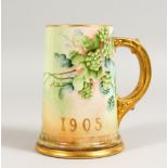 A BELLEEK PORCELAIN COMMEMORATIVE TANKARD, painted with hops, initialled HPCC, dated 1905. 5.75ins