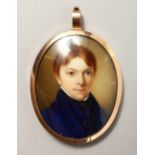AN EARLY 19TH CENTURY PORTRAIT MINIATURE of a young boy in a blue coat, plaited hair to reverse. 2.